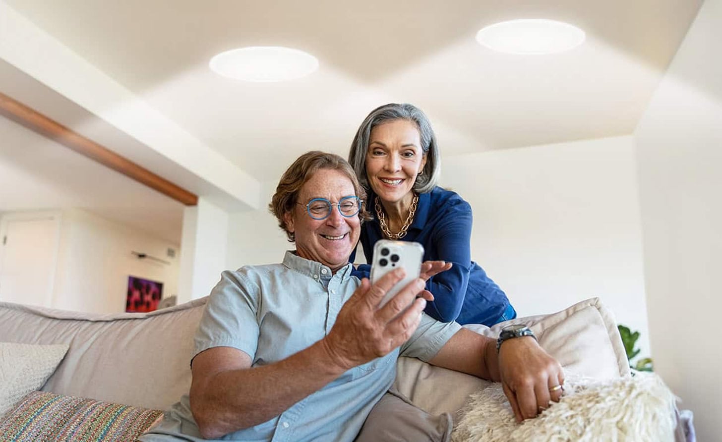 couple looking at financing options on mobile phone